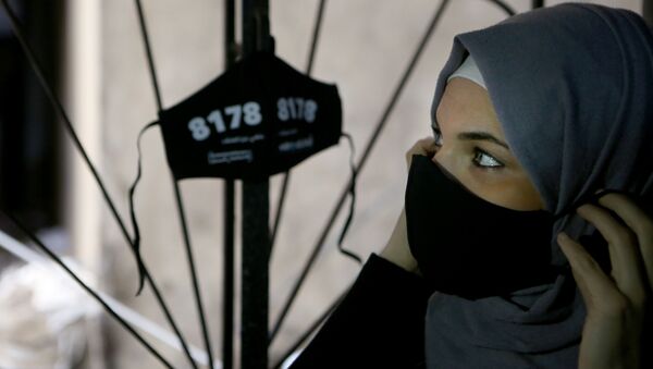 Palestina usa máscara protetora no campo de refugiados de Shatila, Líbano, 8 de dezembro de 2020  - Sputnik Brasil