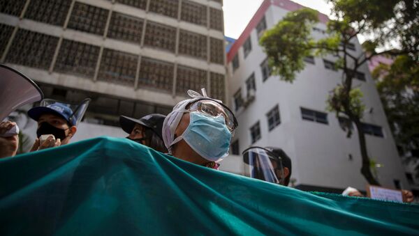 Trabalhadores de saúde protestam em Caracas, na Venezuela - Sputnik Brasil