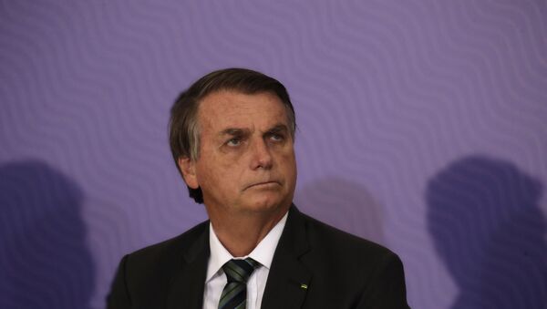 O presidente do Brasil, Jair Bolsonaro, durante cerimônia no Palácio do Planalto. - Sputnik Brasil