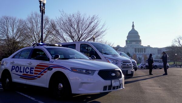 Police vehicles are parked outside the U.S. Capitol, a day after supporters of U.S. President Donald Trump occupied the U.S. Capitol Building in Washington, U.S. January 7, 2021 - Sputnik Brasil