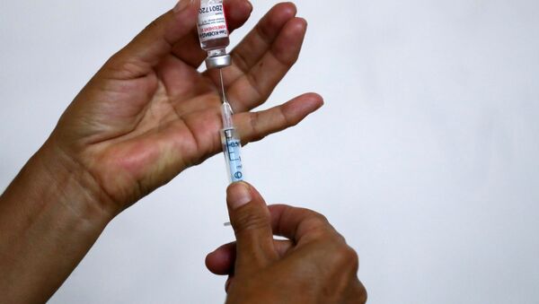 Angela Coronel, nurse in charge of the vaccination process at the San Martin hospital, fills a syringe with the second dose of the Sputnik V (Gam-COVID-Vac) vaccine at the San Martin hospital, in La Plata, on the outskirts of Buenos Aires, Argentina January 21, 2021. - Sputnik Brasil