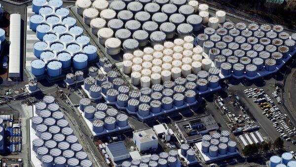 An aerial view shows the storage tanks for treated water at the tsunami-crippled Fukushima Daiichi nuclear power plant in Okuma town, Fukushima prefecture, Japan February 13, 2021, in this photo taken by Kyodo. Picture taken February 13, 2021. - Sputnik Brasil