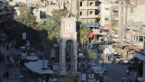 People walk around the Clock Tower of the rebel-held Idlib city, Syria, May 7, 2021. - Sputnik Brasil