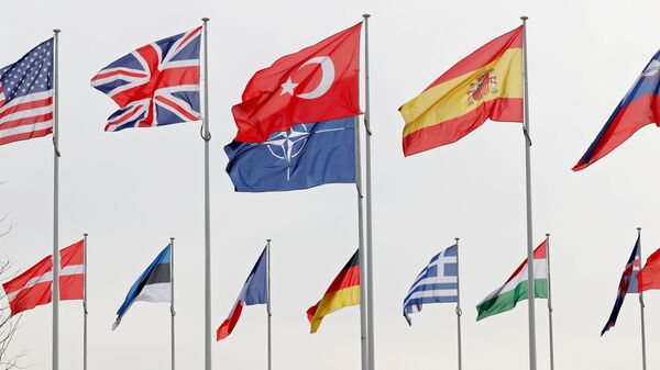 Flags of NATO member countries flutter at alliance headquarters in Brussels, Belgium, February 28, 2020. - Sputnik Brasil