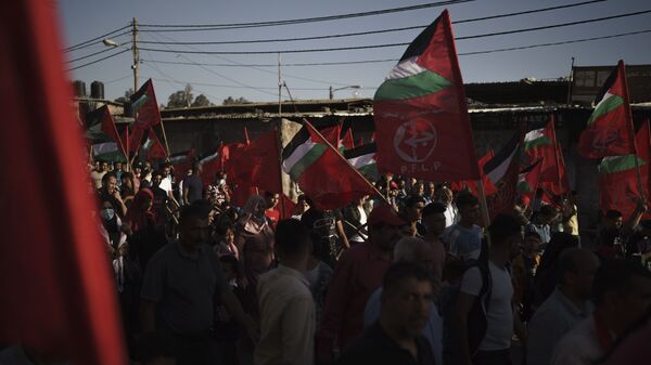 Palestinos participam de ato organizado pela Frente Popular para a Libertação da Palestina (PLFP, na sigla em inglês), na cidade de Gaza, 2 de junho de 2021 - Sputnik Brasil