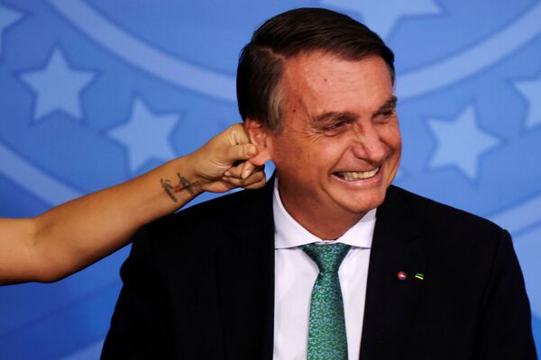 Presidente do Brasil, Jair Bolsonaro, em cerimônia no Palácio do Planalto em Brasília, 24 de novembro de 2021. - Sputnik Brasil