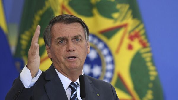 O presidente Jair Bolsonaro participa da cerimônia sobre modernização da prova de vida do INSS, no Palácio do Planalto, em Brasília, no dia 2 de fevereiro de 2022 - Sputnik Brasil