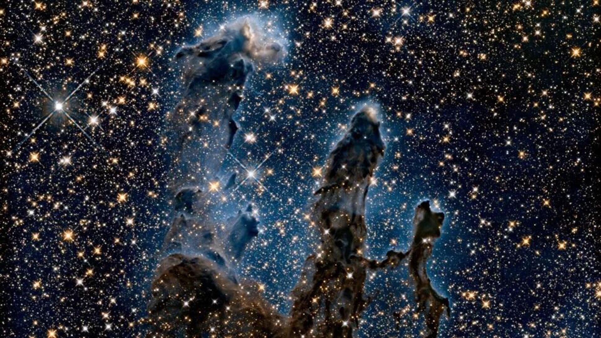 Imagem registrada pelo telescópio Hubble em 2020 da icônica Nebulosa da Águia deverá ficar diferente com a observação infravermelha do James Webb - Sputnik Brasil, 1920, 31.03.2022