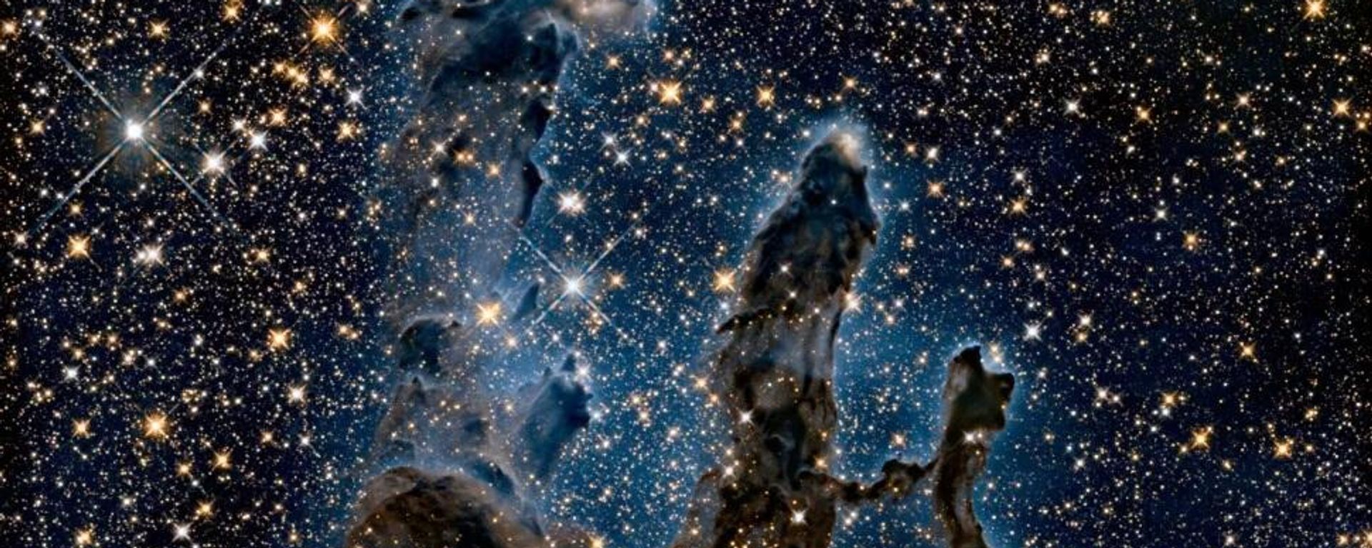 Imagem registrada pelo telescópio Hubble em 2020 da icônica Nebulosa da Águia deverá ficar diferente com a observação infravermelha do James Webb - Sputnik Brasil, 1920, 30.09.2026