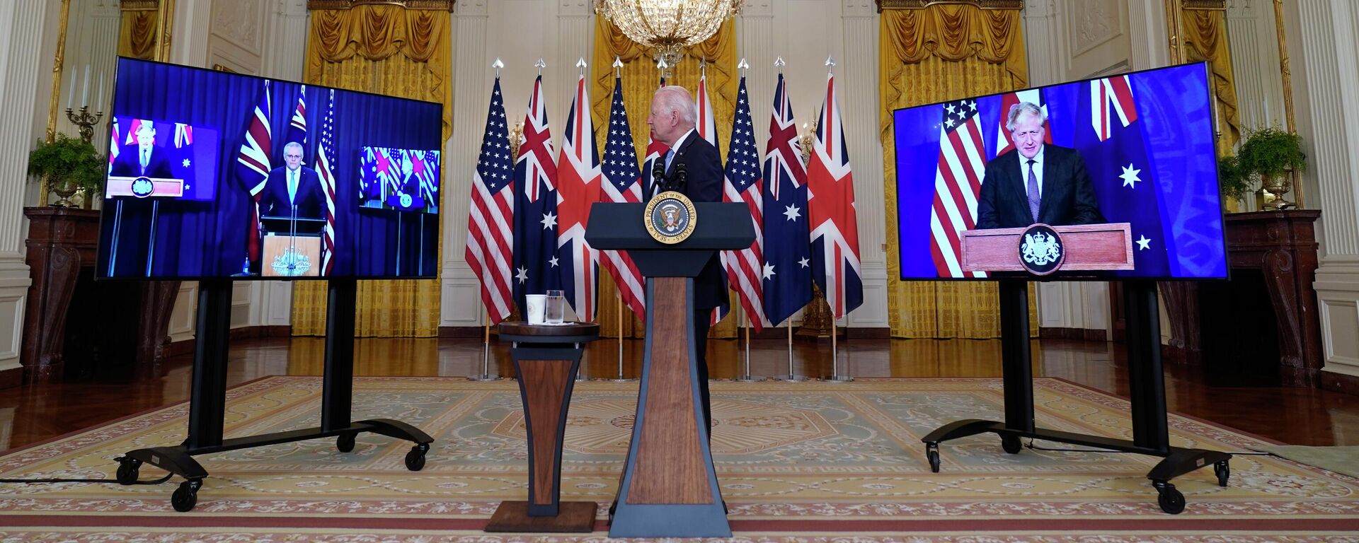 Primeiro-ministro australiano, Scott Morrison, o premiê britânico, Boris Johnson, e o presidente americano, Joe Biden, discutem iniciativa AUKUS em videoconferência na Casa Branca, Washington, 15 de setembro de 2021 - Sputnik Brasil, 1920, 17.07.2023