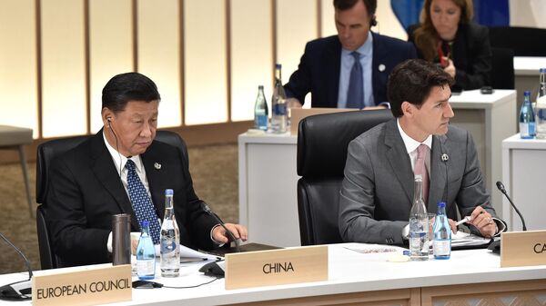 O presidente da China, Xi Jinping, e o primeiro-ministro do Canadá, Justin Trudeau, na Cúpula do G20 em 2019 - Sputnik Brasil