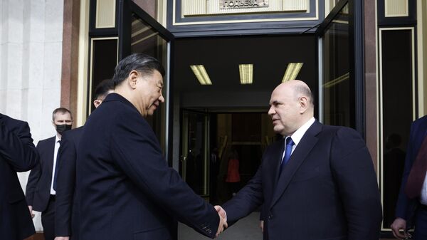 Primeiro-ministro russo, Mikhail Mishustin durante uma reunião com o presidente chinês, Xi Jinping, na terça-feira (21) - Sputnik Brasil