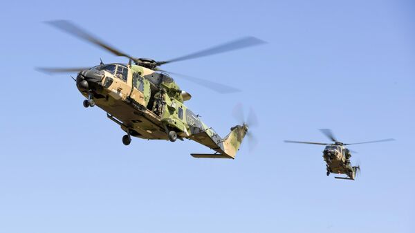 Helicópteros Taipan MRH-90 do Exército australiano se preparam para aterrissar na Área de Treinamento de Campo de Townsville, Townsville, Queensland, Austrália, 10 de maio de 2023 - Sputnik Brasil