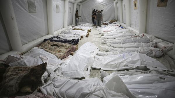 Corpos de pacientes mortos após bombardeio em hospital que deixou pelo menos 500 mortos. Faixa de Gaza, 17 de outubro de 2023 - Sputnik Brasil