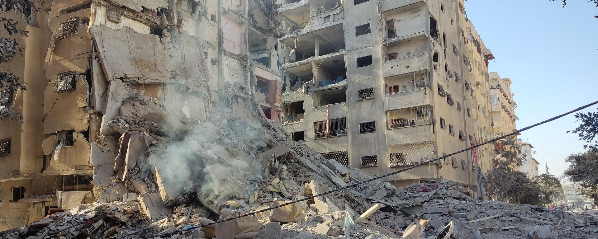 Edifícios destruídos no distrito de Tal al-Hawa, no oeste da cidade de Gaza, enquanto as batalhas entre Israel e o Hamas continuam pela quarta semana, 30 de outubro de 2023 - Sputnik Brasil, 1920, 13.11.2023