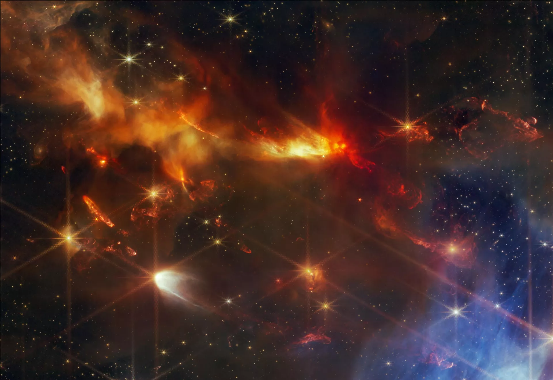 Uma imagem em detalhe mostra cinco dos fluxos protoestelares na nebulosa Serpens Main, todos apontando na mesma direção. Os jatos aparecem como bolhas laranja brilhantes - Sputnik Brasil, 1920, 23.06.2024