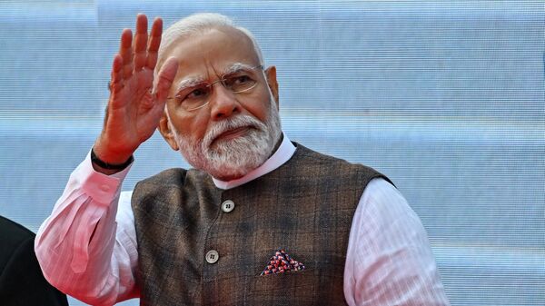 O primeiro-ministro indiano, Narendra Modi, comparece à inauguração da Feira Comercial Global, antes do Vibrant Gujarat Global Summit 2024, em Gandhinagar, em 9 de janeiro de 2024 - Sputnik Brasil
