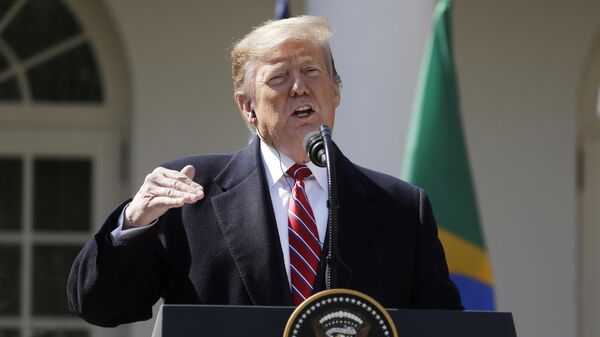 Donald Trump fala durante entrevista coletiva com o então presidente brasileiro Jair Bolsonaro no Rose Garden, da Casa Branca. Washington, D.C., 19 de março de 2019 - Sputnik Brasil