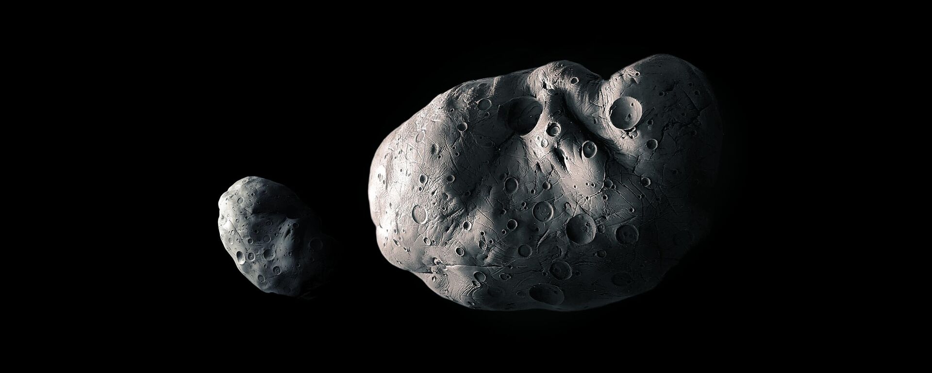 Asteroide grande e pequeno em um fundo preto, ilustração 3D de asteroides rochosos - Sputnik Brasil, 1920, 14.07.2025