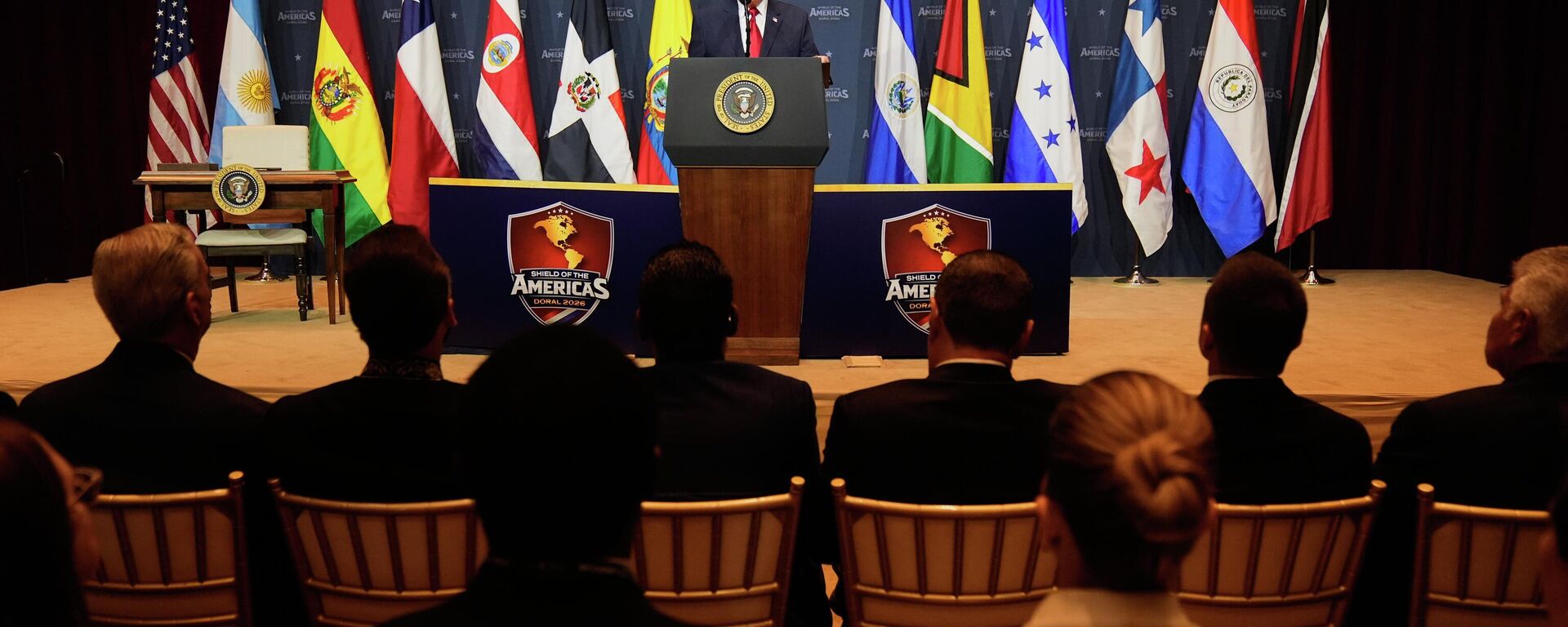 Donald Trump, presidente dos Estados Unidos,  em evento sobre o Escudo das Américas - Sputnik Brasil, 1920, 19.03.2026