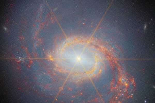 Nova imagem no infravermelho próximo da Galáxia da Lula, obtida pelo Telescópio Espacial James Webb (JWST, na sigla em inglês). As quatro linhas laranjas que se cruzam no centro da imagem não fazem parte da cena, mas são picos de difração gerados pelo próprio instrumento - Sputnik Brasil