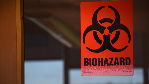 Aviso de material biológico na porta de laboratório - Sputnik Brasil