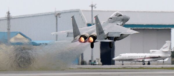 Caça F-15 japonês (foto de arquivo) Caça F-15 japonês (foto de arquivo) - Sputnik Brasil