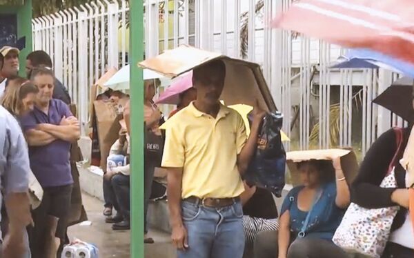 Pessoas nas ruas da Venezuela Pessoas nas ruas da Venezuela - Sputnik Brasil