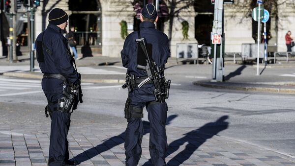 Armed police officers at the Gustaf Adolfs square in central Stockholm, Sweden (file) - Sputnik Brasil