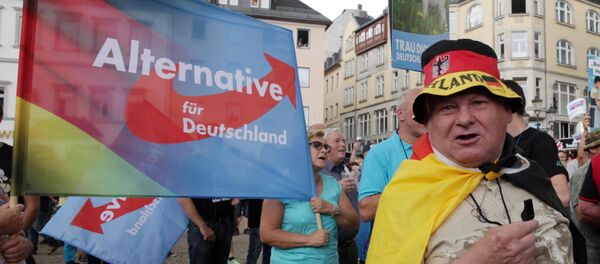 Militantes do partido alemão Alternativa para Alemanha (AfD) protestam contra a chanceler Angela Merkel em Annaberg-Buchholz - Sputnik Brasil