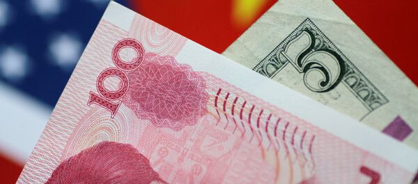U.S. Dollar and China Yuan notes are seen in this picture illustration June 2, 2017 - Sputnik Brasil