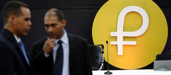The new Venezuelan cryptocurrency Petro logo is seen during its launching in Caracas, Venezuela February 20, 2018 - Sputnik Brasil