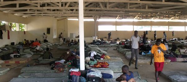 O governo do Acre afirma não ter condições para lidar sozinho com a crise na cidade de Brasileia, principal ponto de entrada de haitianos que vêm ao Brasil sem visto. - Sputnik Brasil