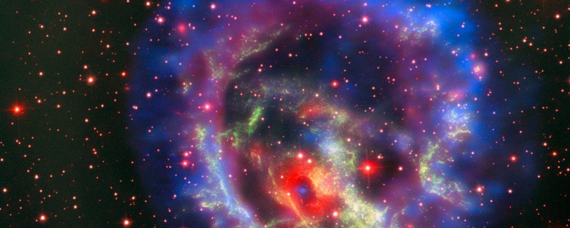 Остатки сверхновой 1E 0102.2-7219, расположенной в ближайшей к нам галактике Малое Магелланово Облако - Sputnik Brasil, 1920, 13.06.2026