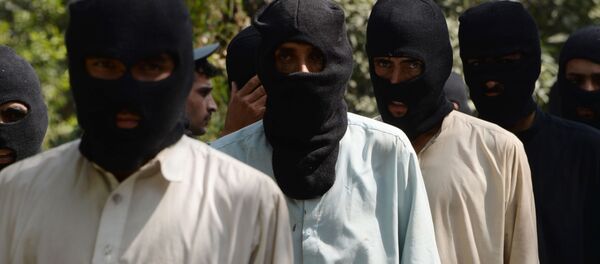 Предполагаемые боевики ИГ (запрещена в России) и движения Талибан в полицейском отделении в Афганистане. Архивное фото - Sputnik Brasil