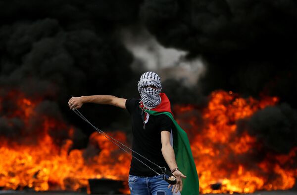Palestino durante um protesto dedicado ao 70º aniversário de Nakba (palavra árabe que significa catástrofe e se refere ao êxodo palestino de 1948) na Faixa de Gaza - Sputnik Brasil
