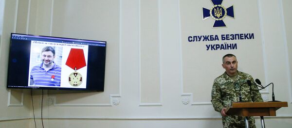 Um retrato do diretor do escritório de Kiev da agência de notícias estatal russa RIA Novosti Kirill Vyshinsky em um monitor durante uma coletiva de imprensa na sede do Serviço de Segurança do Estado ucraniano em Kiev, Ucrânia, 15 de maio de 2018 Um retrato do diretor do escritório de Kiev da agência de notícias estatal russa RIA Novosti Kirill Vyshinsky em um monitor durante uma coletiva de imprensa na sede do Serviço de Segurança do Estado ucraniano em Kiev, Ucrânia, 15 de maio de 2018 - Sputnik Brasil