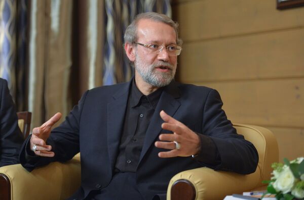 22 de outubro de 2015. Presidente do Conselho Consultivo Islâmico (parlamento) da República Islâmica do Irã, Ali Larijani, durante uma reunião com o presidente russo, Vladimir Putin, após a 12ª Reunião Anual do Clube Valdai de Discussões Internacionais - Sputnik Brasil