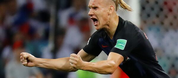 Soccer Football - World Cup - Quarter Final - Russia vs Croatia - Fisht Stadium, Sochi, Russia - July 7, 2018 Croatia's Domagoj Vida celebrates their first goal scored by Andrej Kramaric - Sputnik Brasil