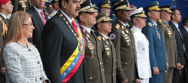 Presidente da Venezuela e sua esposa durante as comemorações dos 81 anos de criação da Guarda Nacional Bolivariana (GNB) Presidente da Venezuela e sua esposa durante as comemorações dos 81 anos de criação da Guarda Nacional Bolivariana (GNB) - Sputnik Brasil