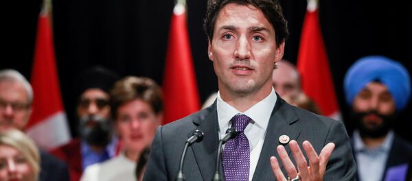 O primeiro-ministro do Canadá, Justin Trudeau, fala à mídia na cidade canadenese de Calgary, em 2017. O primeiro-ministro do Canadá, Justin Trudeau, fala à mídia na cidade canadenese de Calgary, em 2017. - Sputnik Brasil