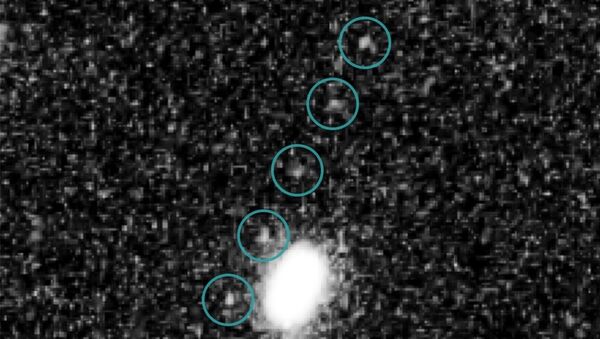 Imagens tiradas pelo telescópio Hubble do objeto Ultima Thule (2014 MU69) do Cinturão de Kuiper, em 24 de junho de 2014 - Sputnik Brasil