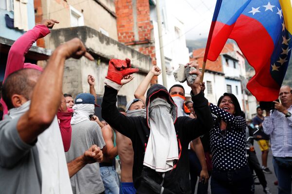Manifestantes em Caracas, Venezuela - Sputnik Brasil