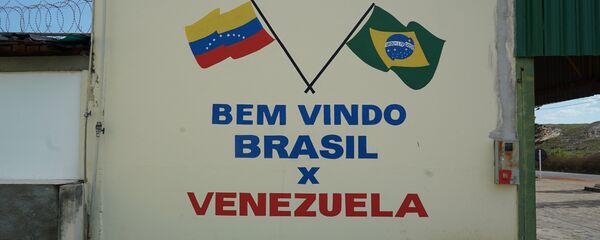 Parede pintada na cidade brasileira de Pacaraima, em Roraima, perto da fronteira com a Venezuela - Sputnik Brasil