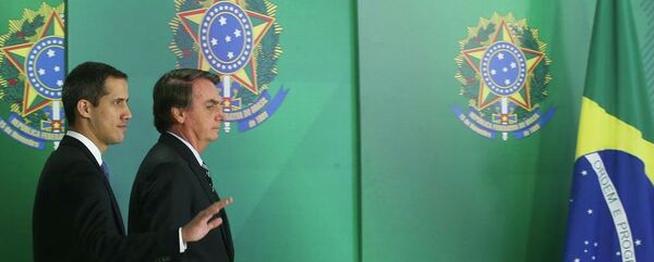 O presidente Jair Bolsonaro durante encontro com o autoproclamado presidente interino da Venezuela, Juan Guaidó, no Palácio do Planalto. - Sputnik Brasil