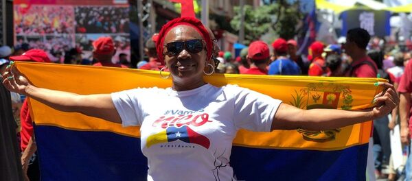 Participante de manifestação de apoio ao presidente venezuelano Nicolás Maduro em Caracas, Venezuela - Sputnik Brasil