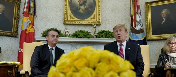 U.S. President Donald Trump speaks while meeting with Brazilian President Jair Bolsonaro in Oval Office of the White House in Washington, U.S., March 19, 2019. - Sputnik Brasil