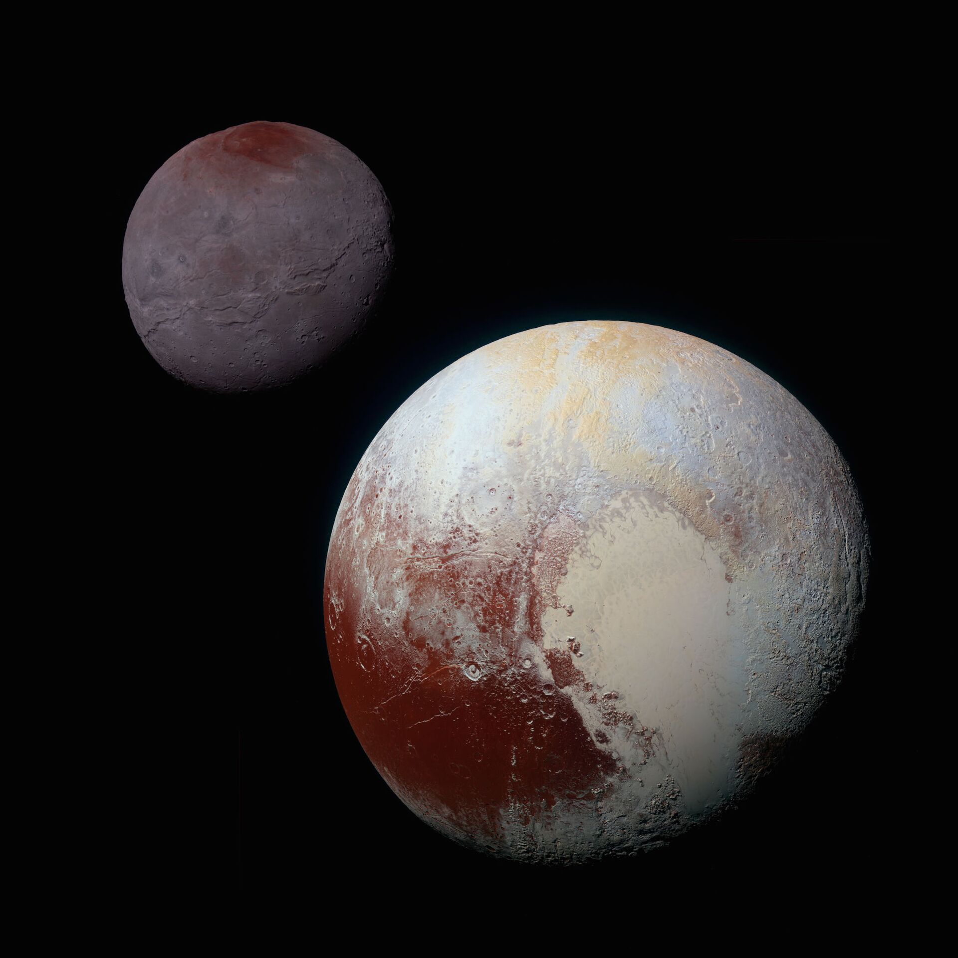Imagem colorida do maior satélite de Plutão, Caronte (canto esquerdo superior) Imagem colorida do maior satélite de Plutão, Caronte (canto esquerdo superior)