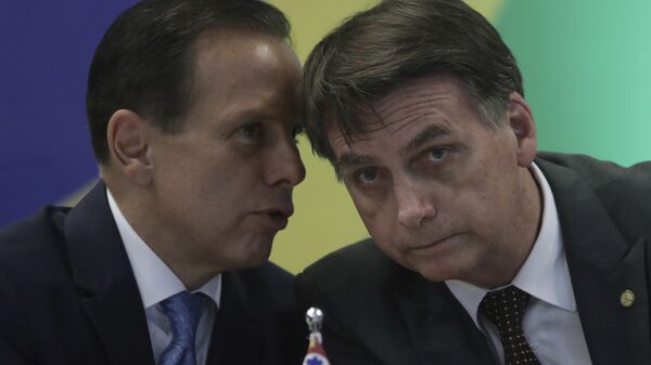 Governador de SP, João Doria, ao lado do presidente, Jair Bolsonaro, durante evento em Brasília antes do pleito de 2018 (foto de arquivo) - Sputnik Brasil