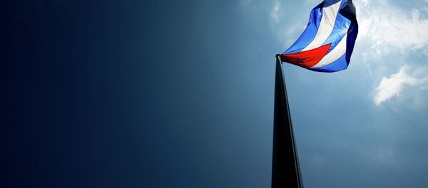 Bandeira cubana tremula sobre sua nova embaixada em Washington. Bandeira cubana tremula sobre sua nova embaixada em Washington. - Sputnik Brasil